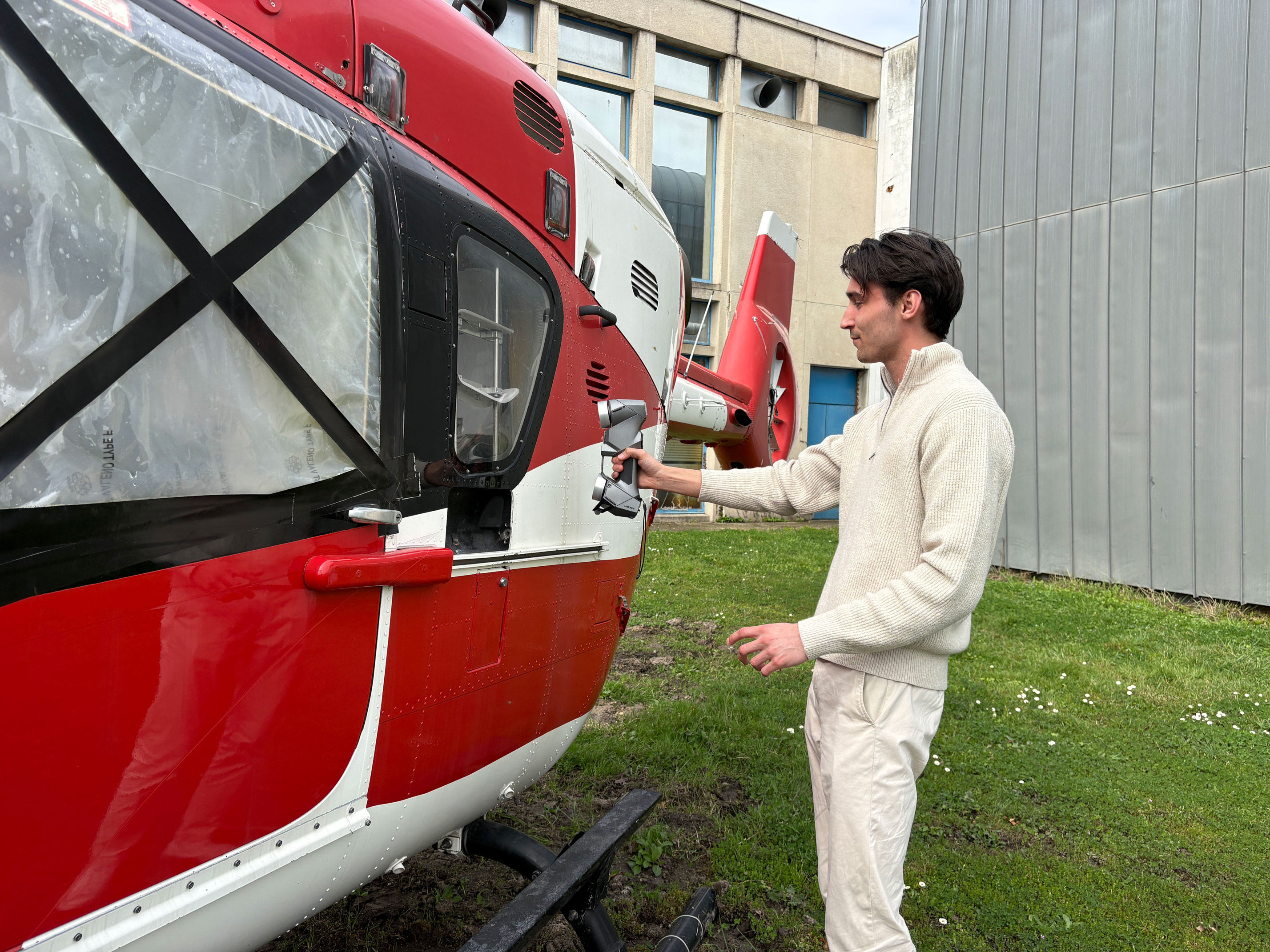 helicopter and man using a 3D scanner